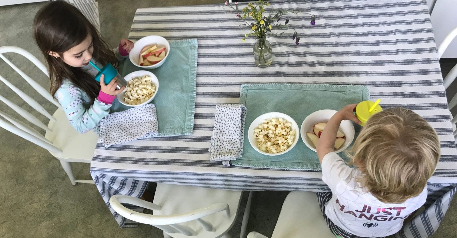 Children gathered around the table for a meal